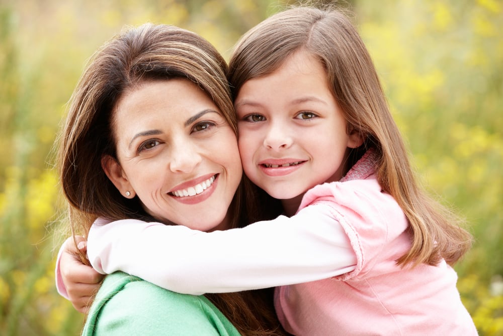 mother-and-daughter-smiling-happily - Dream Dental Implant Center.